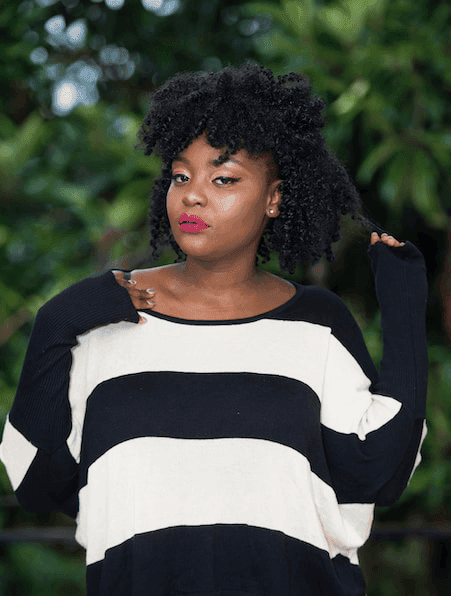 Woman in a striped sweater outdoors